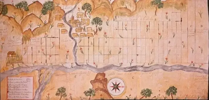 Fragmento del plano del pueblo de San Juan de Maracapana y de las tierras repartidas a los indios del mismo. 1703. Archivo General de Indias. (p. 131) Pino Iturrieta, E. (Coord.). (2006). Historia Global de Venezuela: Vol. I. Venezuela Precolombina y época colonial. Editorial Globe. ISBN 980-6427-14-9. Depósito Legal: lf 816200590052.A. CC-BY-NC-ND 4.0